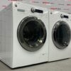 Used GE 24” Front Load Washer and Dryer WCVH4800K2WW PCVH480EK0WW Set side