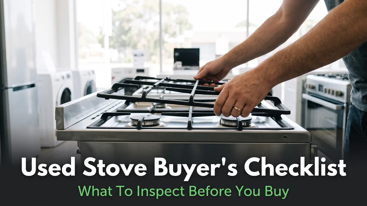 hands inspecting the burners of a used stove in an appliance showroom before buying